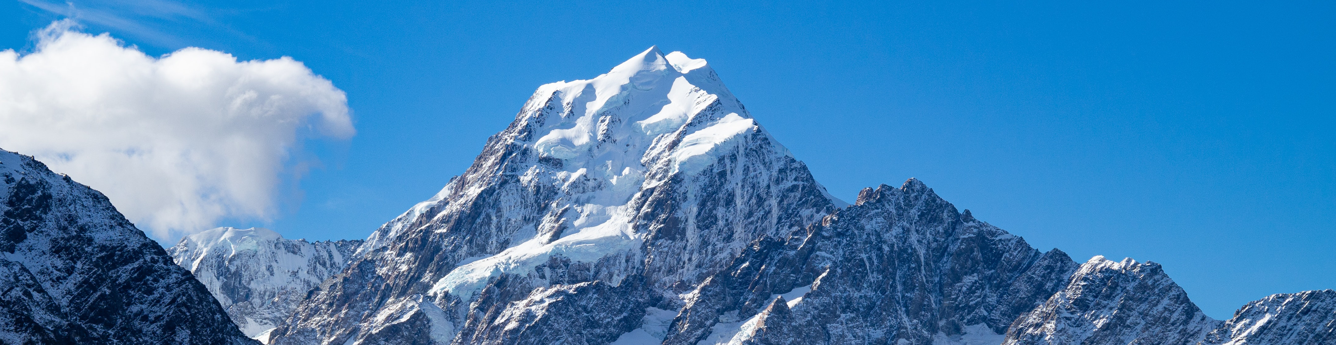 A large banner featuring a breathtaking mountain range.